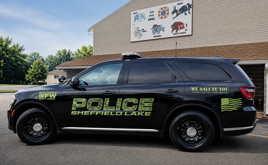 Sheffield Lake police SUV with camouflage-pattern vinyl lettering and a subdued flag graphic, sponsored by VFW Post 8666